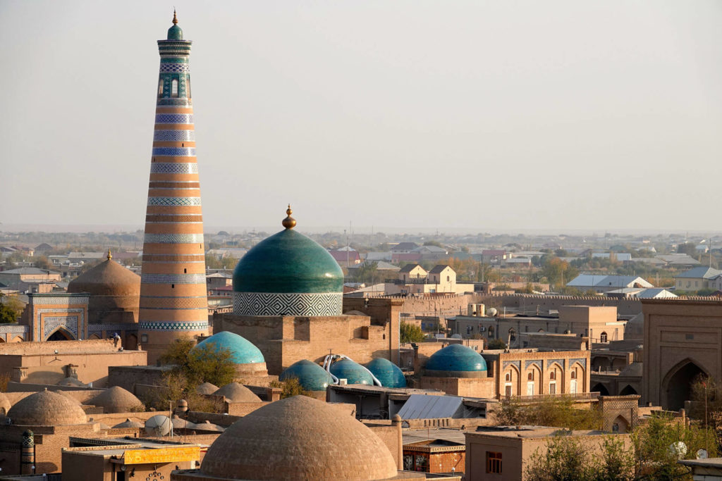 The turquoise dome and majestic minaret in UNESCO listed Khiva. Uzbekistan. Photo credit: Hermann Esser