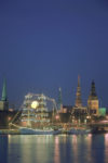 Lighted boats illuminate Daugava River in Riga, Latvia. Photo credit: Ainars Meiers