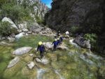 A guide leads his canyoning group through the Cetina River in Croatia. Photo credit: Iris Adventures