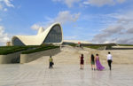 Designed by Iraqi-British female architect Zaha Hadid, the massive Heydar Aliyev Center is a popular spot for photo ops. Photo credit: Ann Schneider