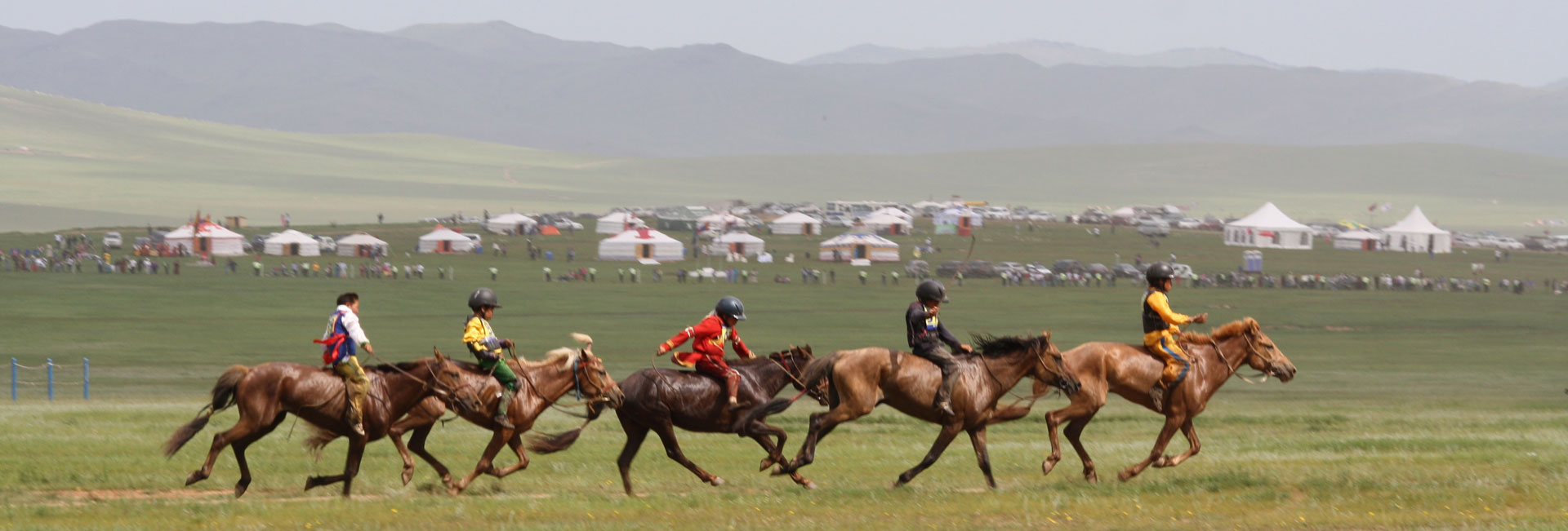 Horse racing games at Mongolia's Naadam Festival. Photo credit: Devin Connolly