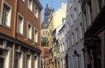 Historic buildings elegantly curve along a narrow street in Riga, Latvia. Photo credit: Martin Klimenta