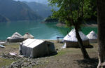 Camping near the serene shores of the Heavenly Lake of Tianshan. Photo credit: Julia Rindlaub.