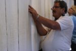 Tour participants searching for relatives in the Book of Names, Auschwitz. Photo Credit: Joanna Millick