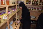 A nun tends to wares at the Phoka Nunnery.