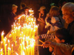 The faithful light candles at Geghard Monastery (Armenia.) Photo credit: Martin Klimenta