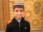 Turkmen boy wearing a traditional talhya cloth skullcap (Ashgabat, Turkmenistan). Photo credit: Michel Behar
