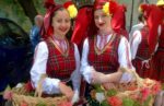 Meeting friendly local girls in traditional clothing, Bulgaria. Photo credit: Michel Behar