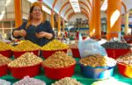 Chatting with vendors at the Panjshabne Bazaar in Khujand. Tajikistan. Photo credit: Michel Behar