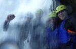 Enjoying exploring some waterfalls on a canyoning adventure. Photo credit: Iris Adventures