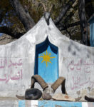 Revered horns of ibex and Marco Polo sheep adorn an Ismaili Shi'a religious shrine along the Pamir Highway. Photo credit: Jake Smith