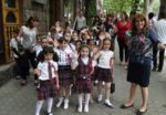 School kids wave hello in Yerevan, Armenia. Photo credit: Martin Klimenta