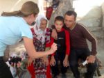 Three generations in a traveler’s photo in Kokand, Uzbekistan. Photo credit: Michel Behar