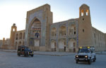 Land Rovers take their places for a sunrise video shoot in Bukhara, Uzbekistan. Photo credit: Douglas Grimes