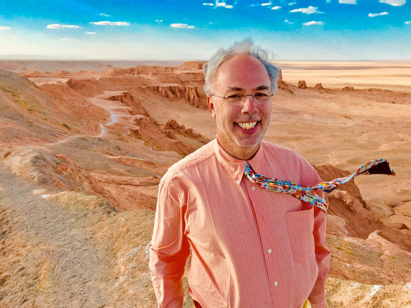 A photograph of MIR Tour Manager Michel Behar in the South Gobi Desert while on the recent departure of Mongolia's Golden Eagle Festival