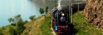 Steam-hauled train hugging Lake Baikal, Russia.