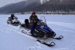 Zipping around Lake Baikal on a snowmobile. Photo credit: Douglas Grimes