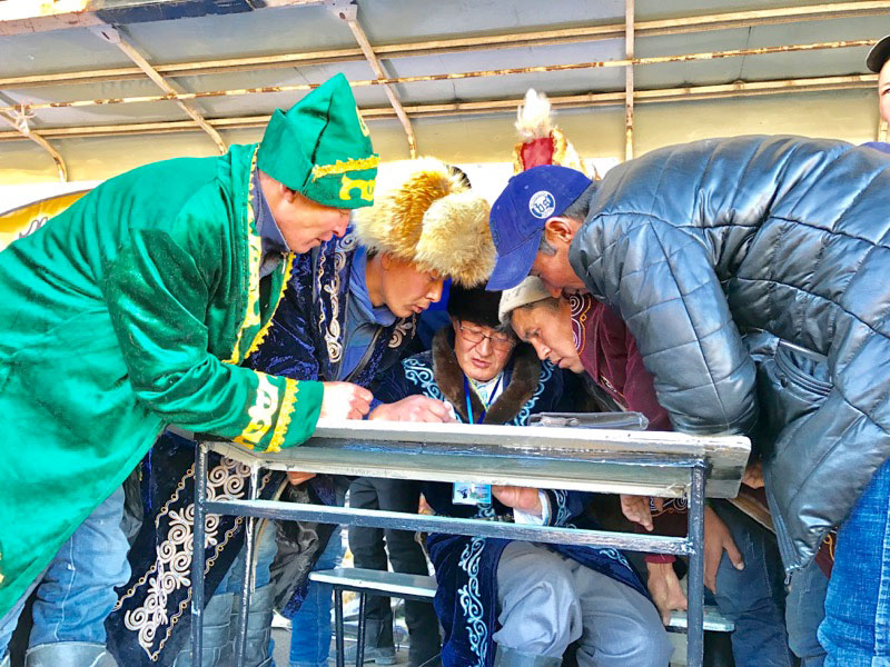 Tabulating the scores at Mongolia’s Golden Eagle Festival. Photo: Michel Behar