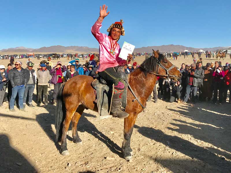 A proud winner at the Golden Eagle festival in Mongolia. Photo: Michel Behar