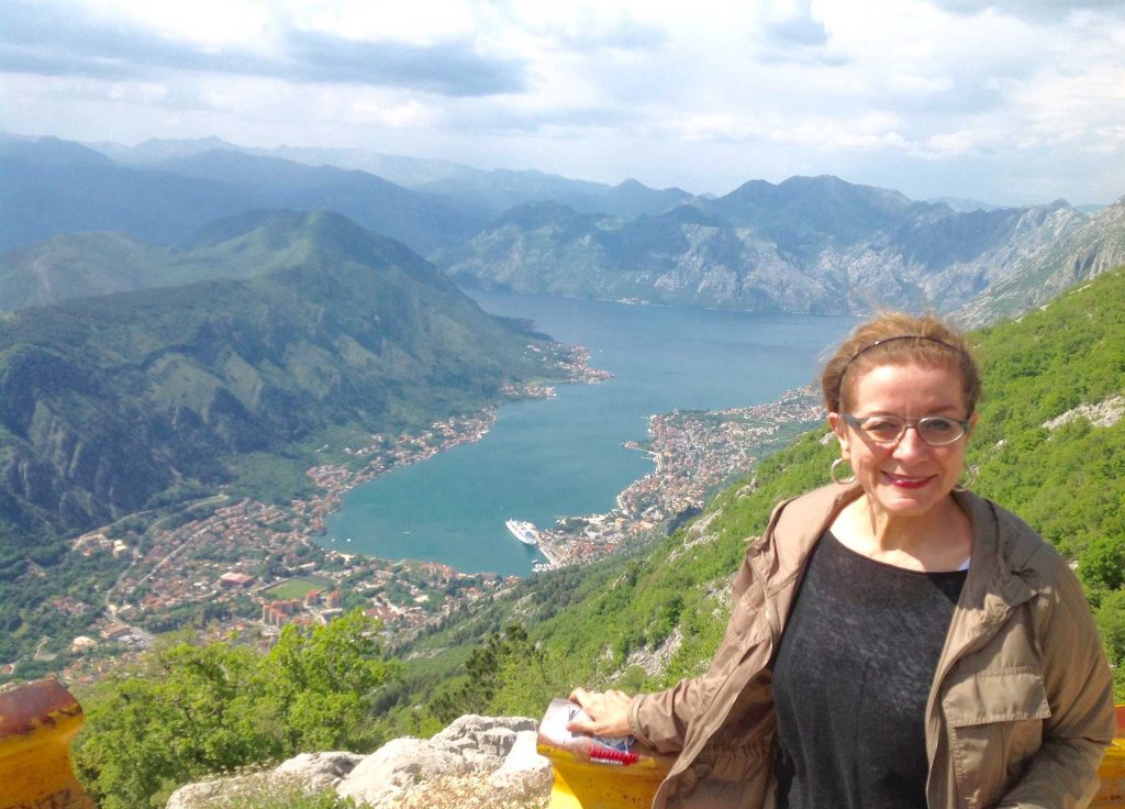 Patricia Schultz, author of "1,000 Places to See Before You Die", traveled to the Balkans with MIR; here she's pictured in Montenegro, overlooking the Bay of Kotor. Photo credit: Michel Behar