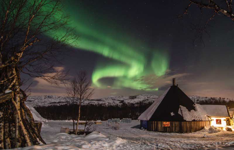 One of the Snow Hotel’s buildings, a timbered restaurant. Photo credit: Kirkenes Snow Hotel / Nevra Pictures