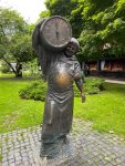 Statue of a man carrying a beer barrel in Lviv, Ukraine. Photo credit: Luba Rudenko
