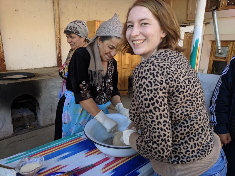 Marisa trying her hand at making traditional Uzbek bread. Photo credit: Matt Robertson