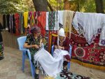 Tajik women adding a finishing touch to their textile. Photo credit: Dilshod Karimov