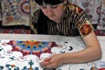 Save room in your suitcase for suzani, hand-embroidered Central Asian designs. Photo credit: Christine Z. Anderson
