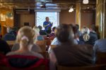 Expert lecturer aboard the ship as it sails the Barents Sea. Photo credit: Anthony Smith