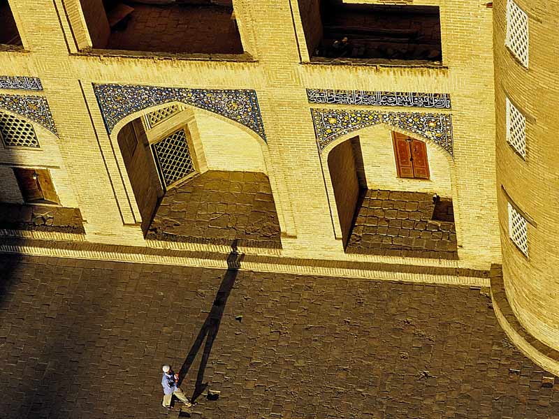 A lone shadow amid the ancient architecture of Central Asia. Photo credit: Peter Guttman