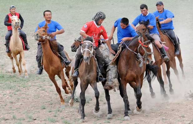 Competitors tussle in a lively Kyrgyz horse game similar to polo. Photo credit: Christine Z. Anderson