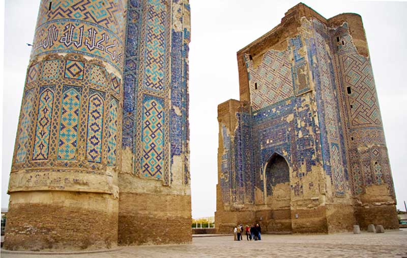 Once 65 meters tall, only parts of the blue, gold, and white mosaic Ak Saray Palace gate towers remain, under UNESCO protection. Photo credit: Jens Frank