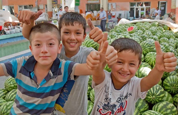 Young boys offer a warm welcome to Khujand's Panjshanbe Bazaar. Photo credit: Richard Fejfar