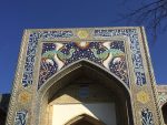 The grand portal of Nadir Divan-Begi Madrassah is tiled with mythical phoenix, white deer, and a Mongolian sun. Photo credit: Abdu Samadov