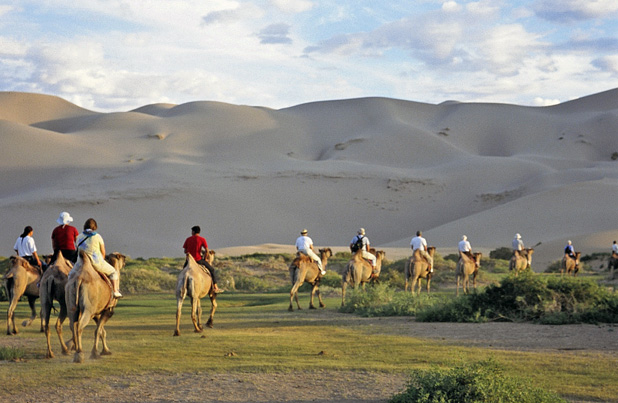 Group camel ride in Mongolia. Photo credit: Michel Behar