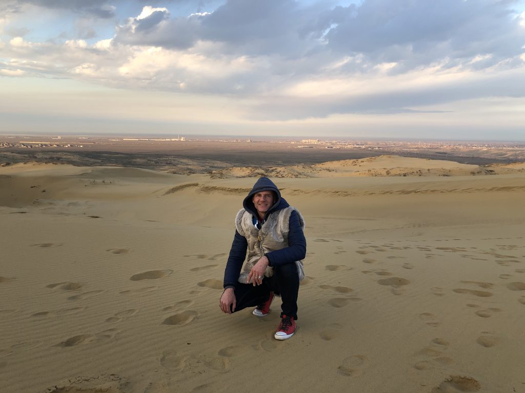 Exploring the Sarykum sand dune in Dagestan, Russia. Photo credit: John Seckel