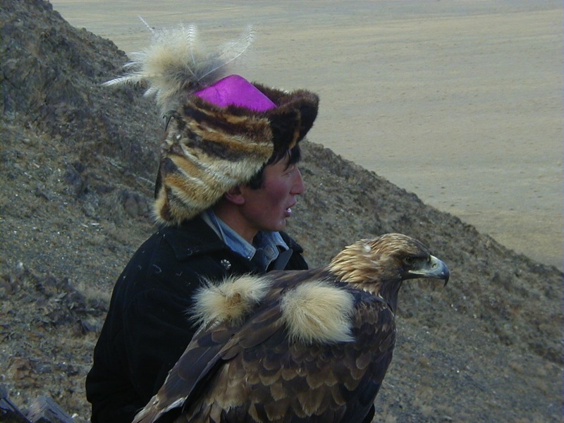 A fox-fur hat and an eagle ready for take-off in Mongolia. Photo credit: Nomadic Expeditions