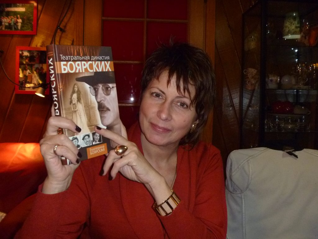 A photo of Katya holding up her book, "The Boyarsky Theater Dynasty." Photo credit: Liz Riley