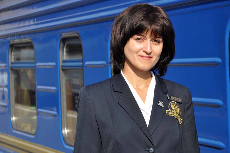 A Golden Eagle attendant ready to greet passengers aboard the private train