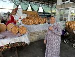A kind bread seller at Uzbek bazaar.