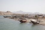 Ships pulled up to shore in Oman. Photo credit: Courtesy of Desert Adventures