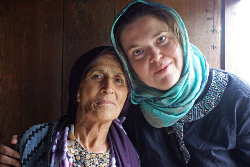 Almost as if a reflection in a mirror, Joanna and her Iranian friend pause for a photo; they met by chance in 2006. Photo credit: Joanna Millick