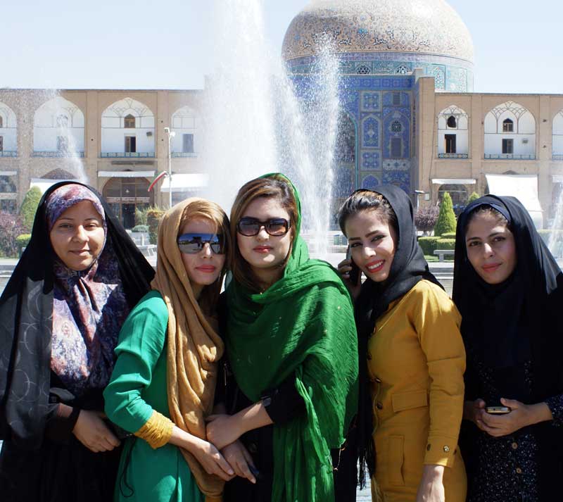 Creative interpretations of hijab in Isfahan, Iran’s Imam Square. Photo credit: Joanna Millick