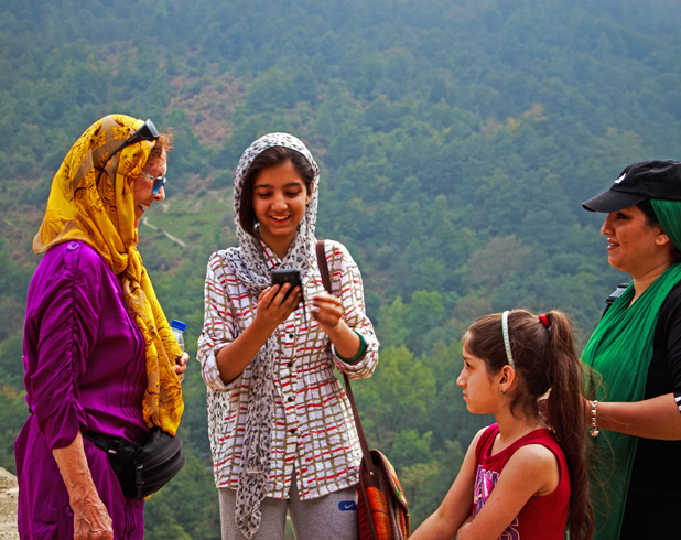 Sharing photos, laughter and friendship in Iran. Photo credit: Lindsay Fincher