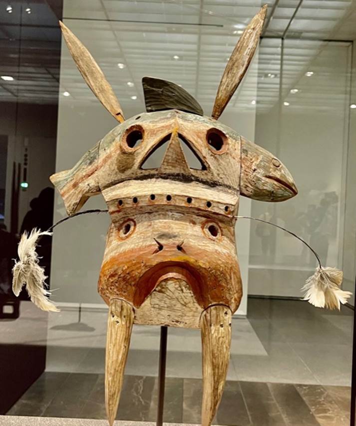 A totem pole representing a fish, a rabbit, and a human. Photo credit: Michel Behar