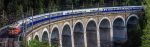 The Danube Express crossing over a viaduct in the Alps.