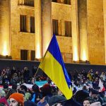 A Ukrainian flag at a rally in Tbilisi. Credit: Mariam Merebashvili
