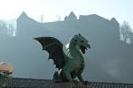 Dragon Bridge in the mist below Ljubljana Castle.