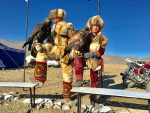 Eagle hunters dressed in traditional fur outfits..